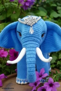 Handmade amigurumi crochet elephant with big floppy ears and soft trunk, made with grey and pink yarn. Elephant Crochet Pattern Free 