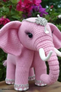 Handmade amigurumi crochet elephant with big floppy ears and soft trunk, made with grey and pink yarn. Elephant Crochet Pattern Free 