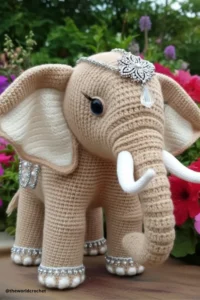 Handmade amigurumi crochet elephant with big floppy ears and soft trunk, made with grey and pink yarn. Elephant Crochet Pattern Free 