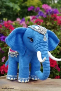 Handmade amigurumi crochet elephant with big floppy ears and soft trunk, made with grey and pink yarn. Elephant Crochet Pattern Free 
