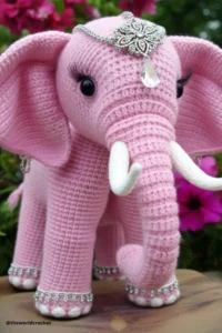 Handmade amigurumi crochet elephant with big floppy ears and soft trunk, made with grey and pink yarn. Elephant Crochet Pattern Free 