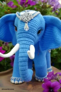 Handmade amigurumi crochet elephant with big floppy ears and soft trunk, made with grey and pink yarn. Elephant Crochet Pattern Free 