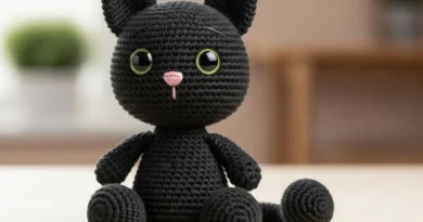 Cute crochet cat pattern – handmade black amigurumi cat with green eyes and pink nose