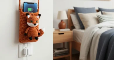 Crochet fox phone holder made with orange and white yarn holding a phone
