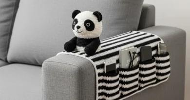 Crochet Sofa Arm Organizer Pattern with black and white stripes and a panda amigurumi