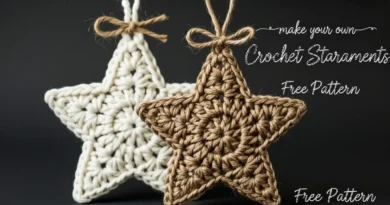 Small five-point crochet star ornament in cream bulky yarn hanging from jute on a decorated Christmas tree