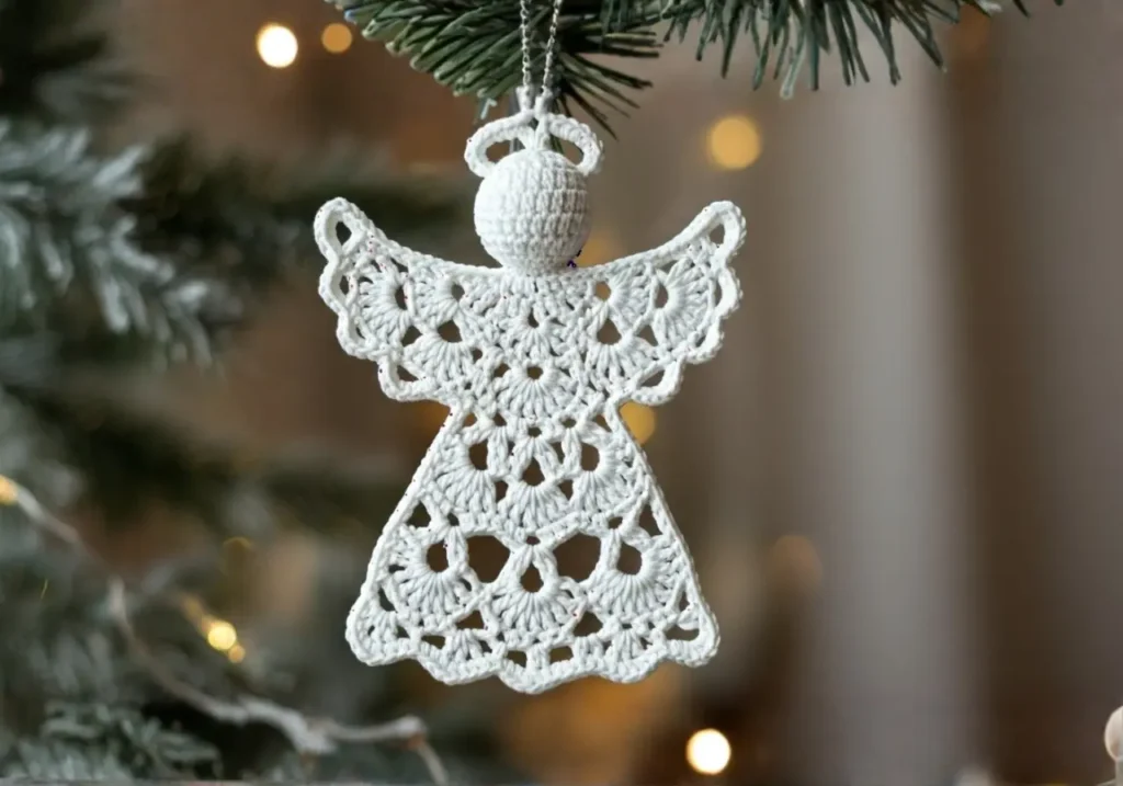 Handmade 6-inch crochet angel ornament with detailed lace skirt and wings. Crochet Angel Pattern
