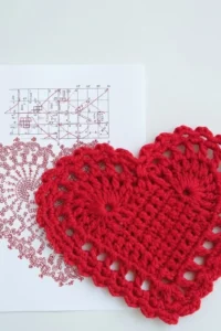 Crochet heart coaster pattern made with cotton yarn in US crochet terms