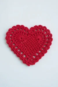 Crochet heart coaster pattern made with cotton yarn in US crochet terms