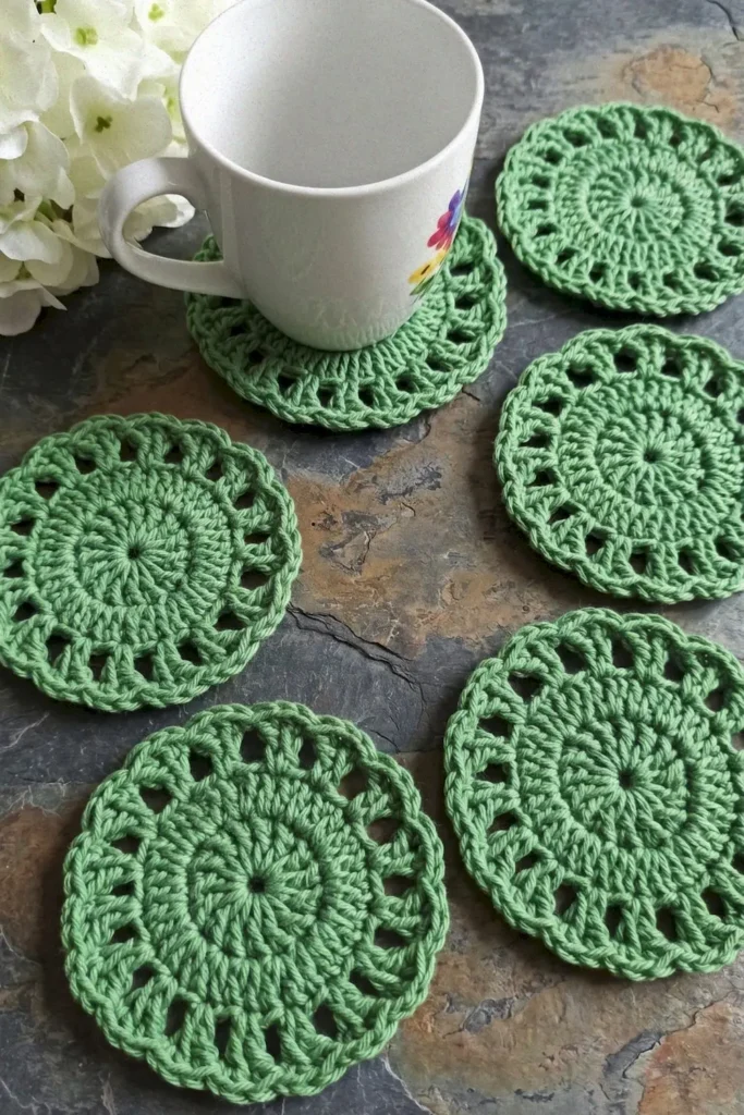 Easy lacy crochet coaster pattern made with cotton yarn in a delicate round lace design